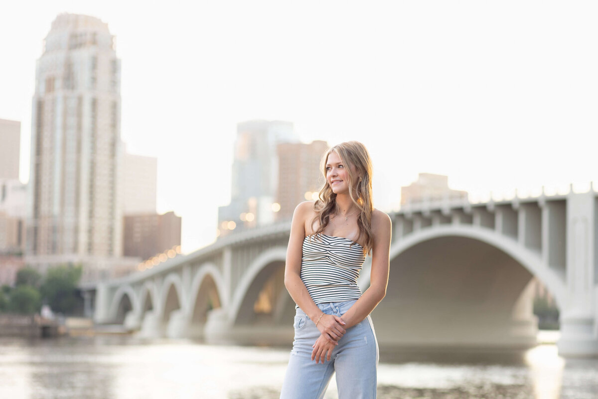 high school senior girl by Stone arch bridge
