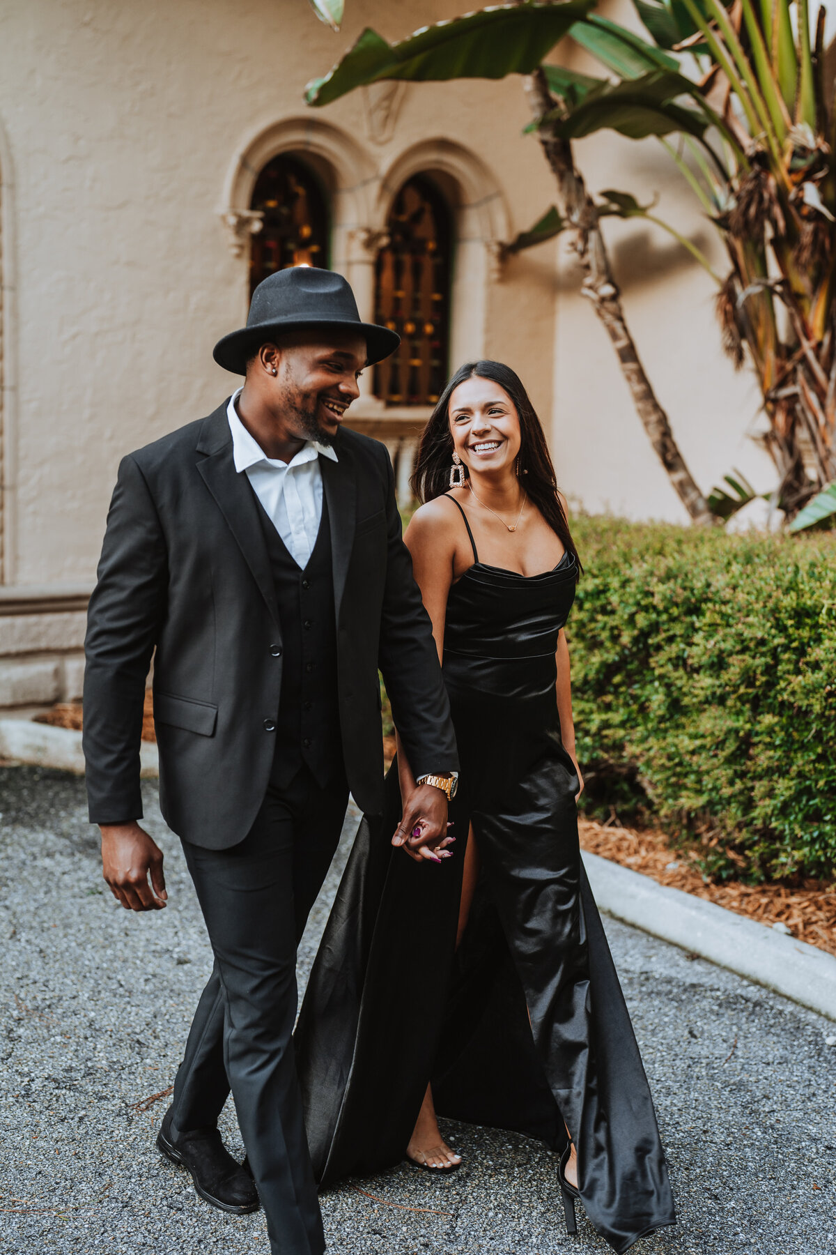 couple dressed up walking and smiling at eachother at powell crosley estate