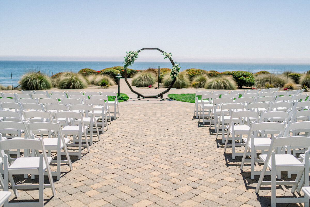 Wedding ceremony arch at Dolphin Bay Resort in Pismo Beach, CA