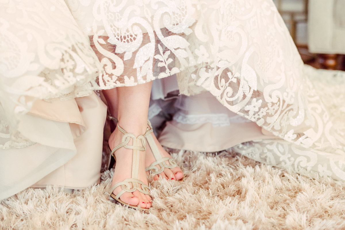 bride with cream bridal shoes