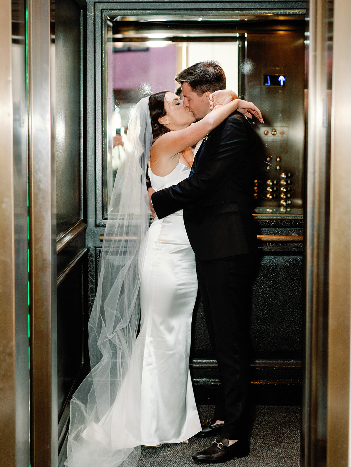 Bride and groom in hotel elevator in DC