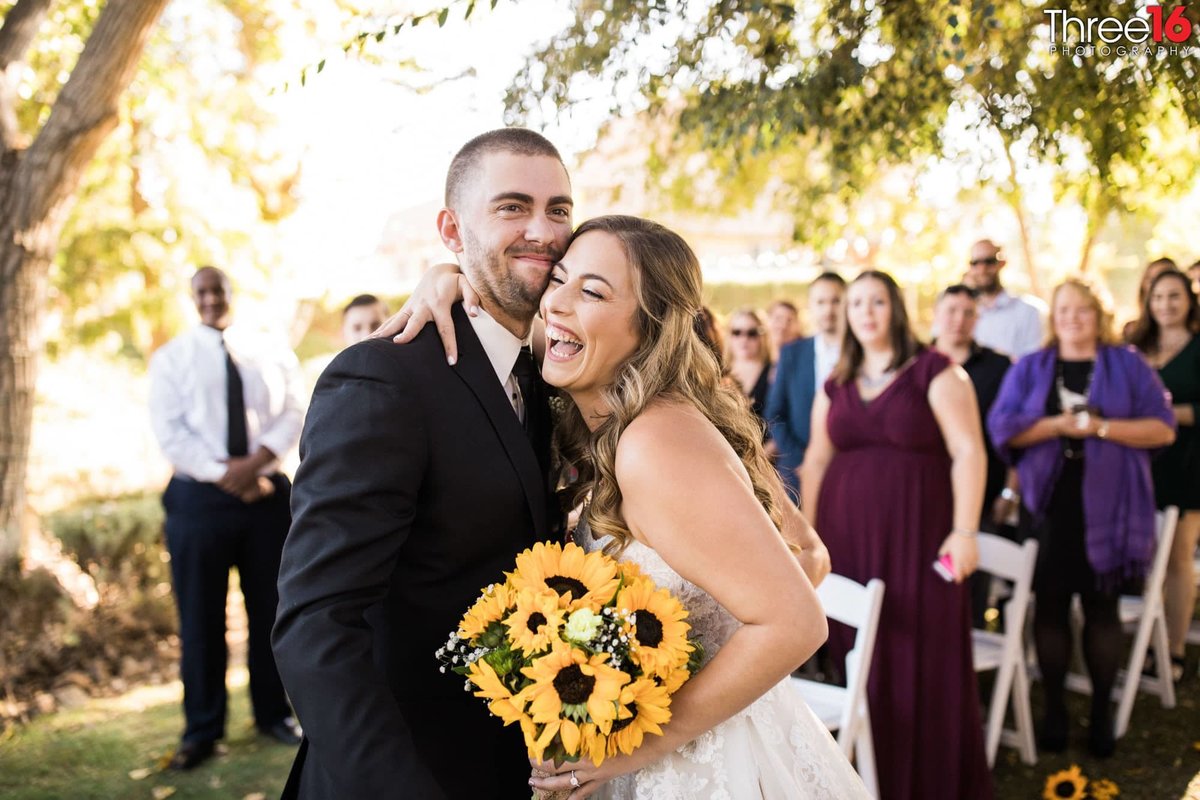 Bride display a big laugh with her new husband