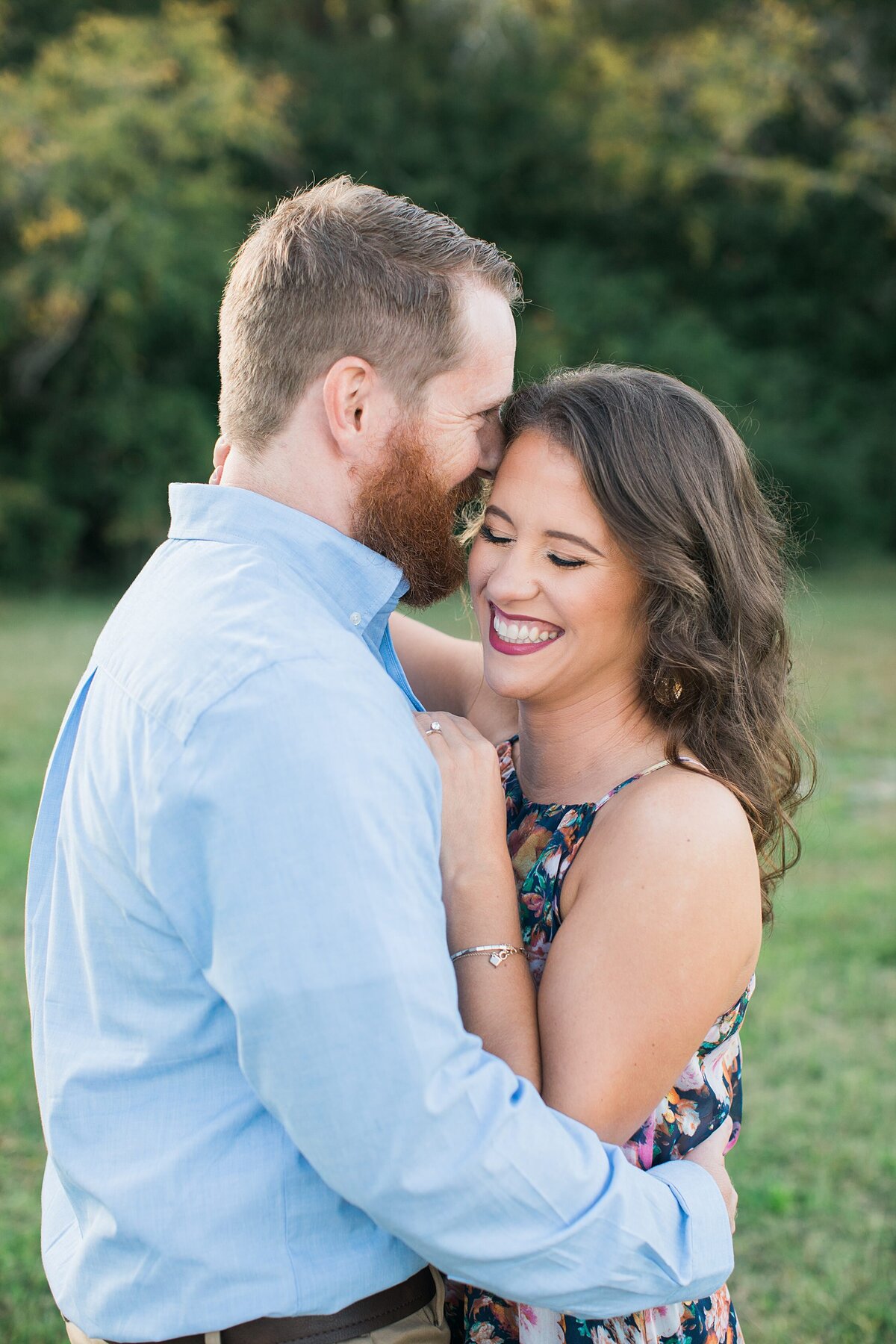 Greenville  Wedding Photographer, couple smiling and holding each other close