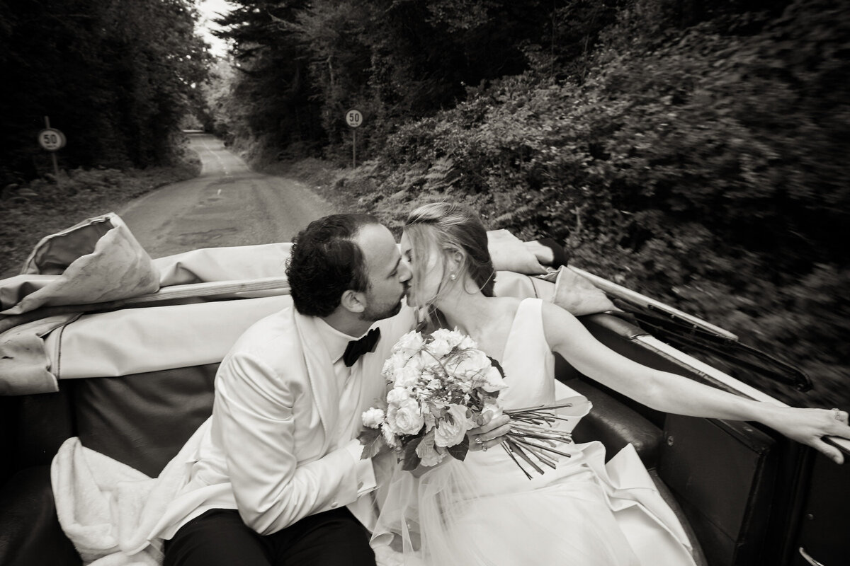 Newlyweds Kissing Sheen Falls Lodge Wedding