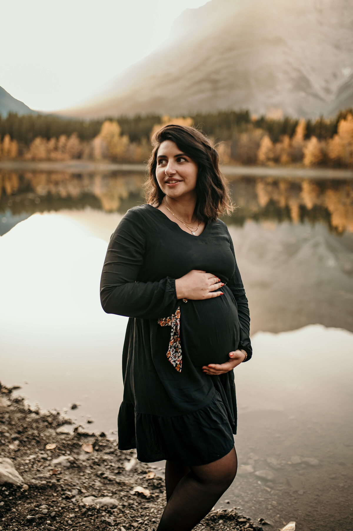 pregnant lady in front of lake