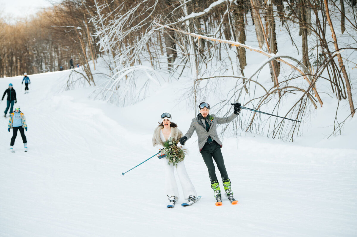 bride and groom skiing down killington mountain resort in vermont at adventure elopement