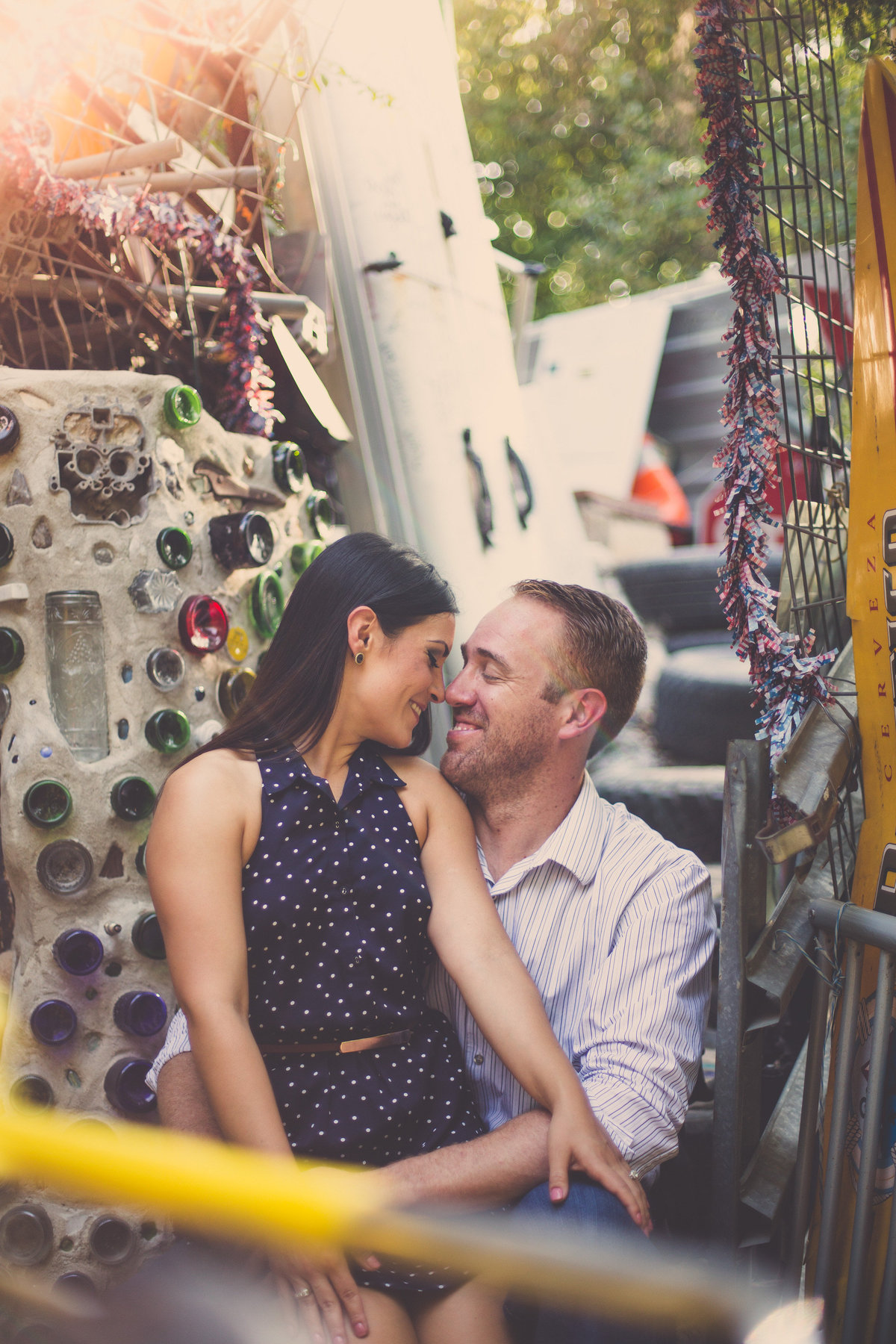 Fiancé staring into his fiancée eyes at the Cathedral of Junk in Austin, TX at their engagement session by Expose The Heart.