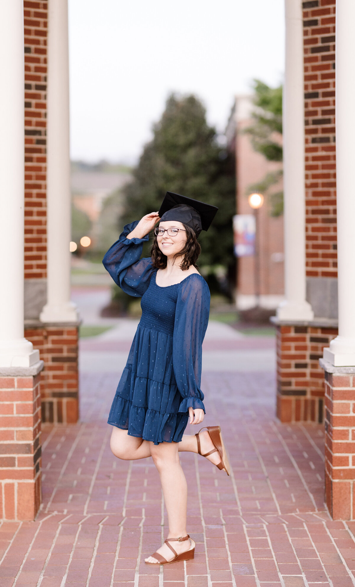 college senior holding her graduation cap
