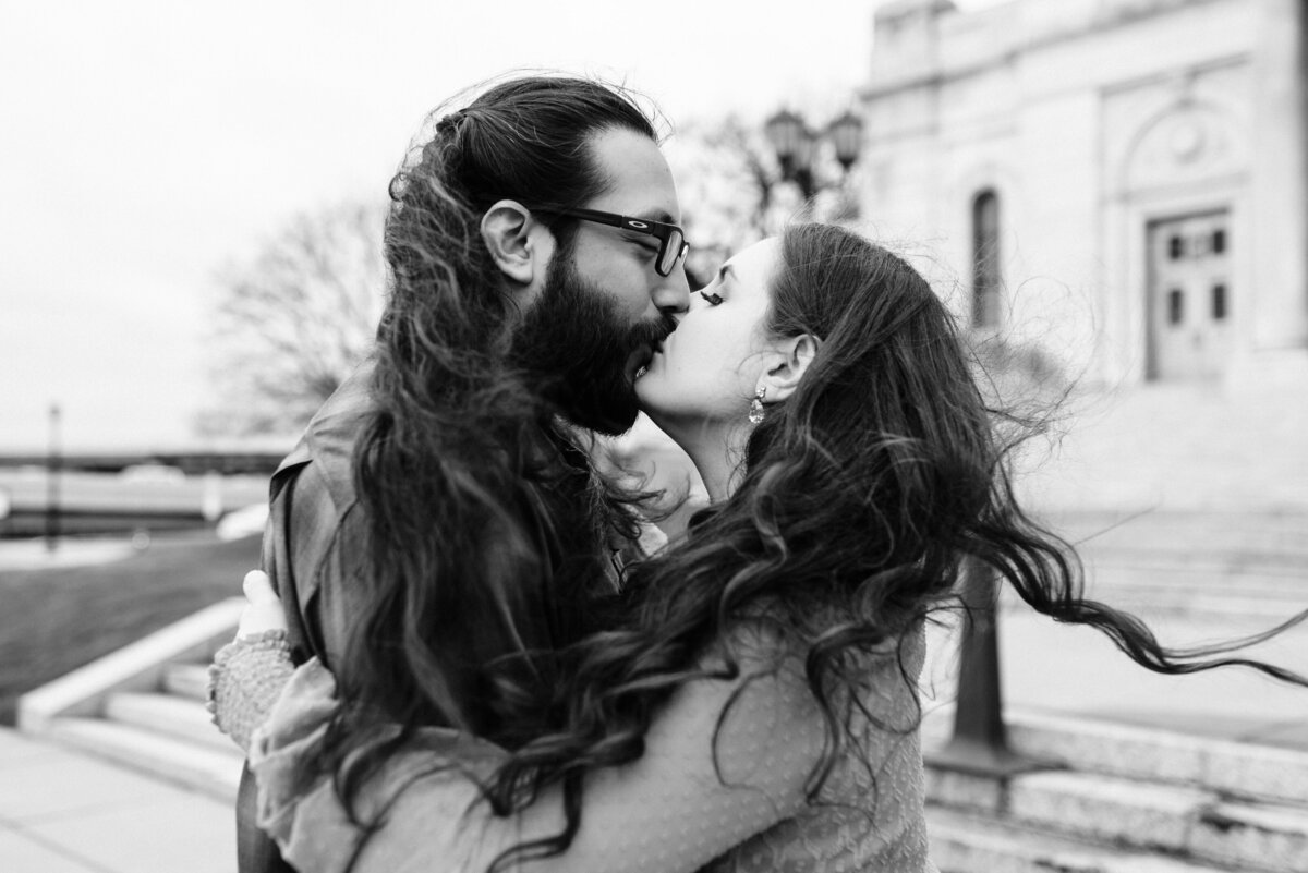 Couple kissing with long hair blowing in the wind