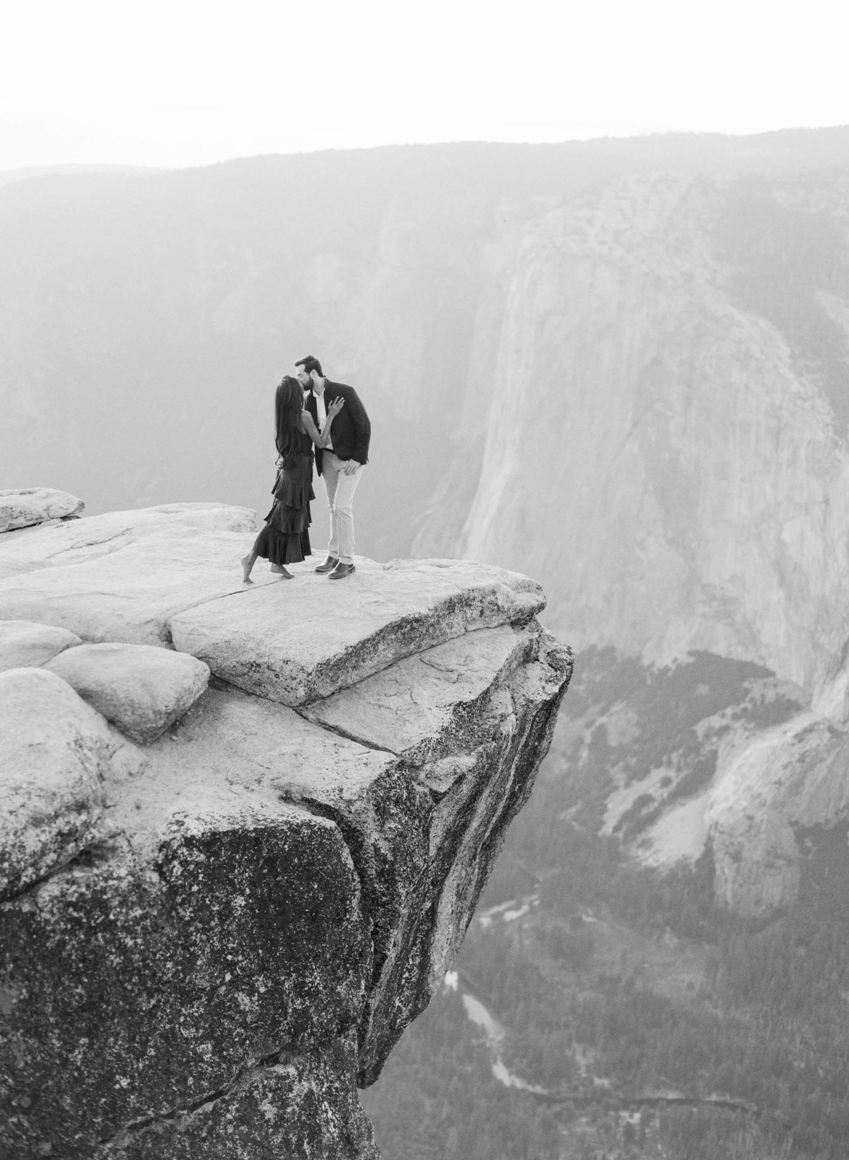 48-KTMerry-weddings-engagement-photography-Yosemite-cliff-black-white