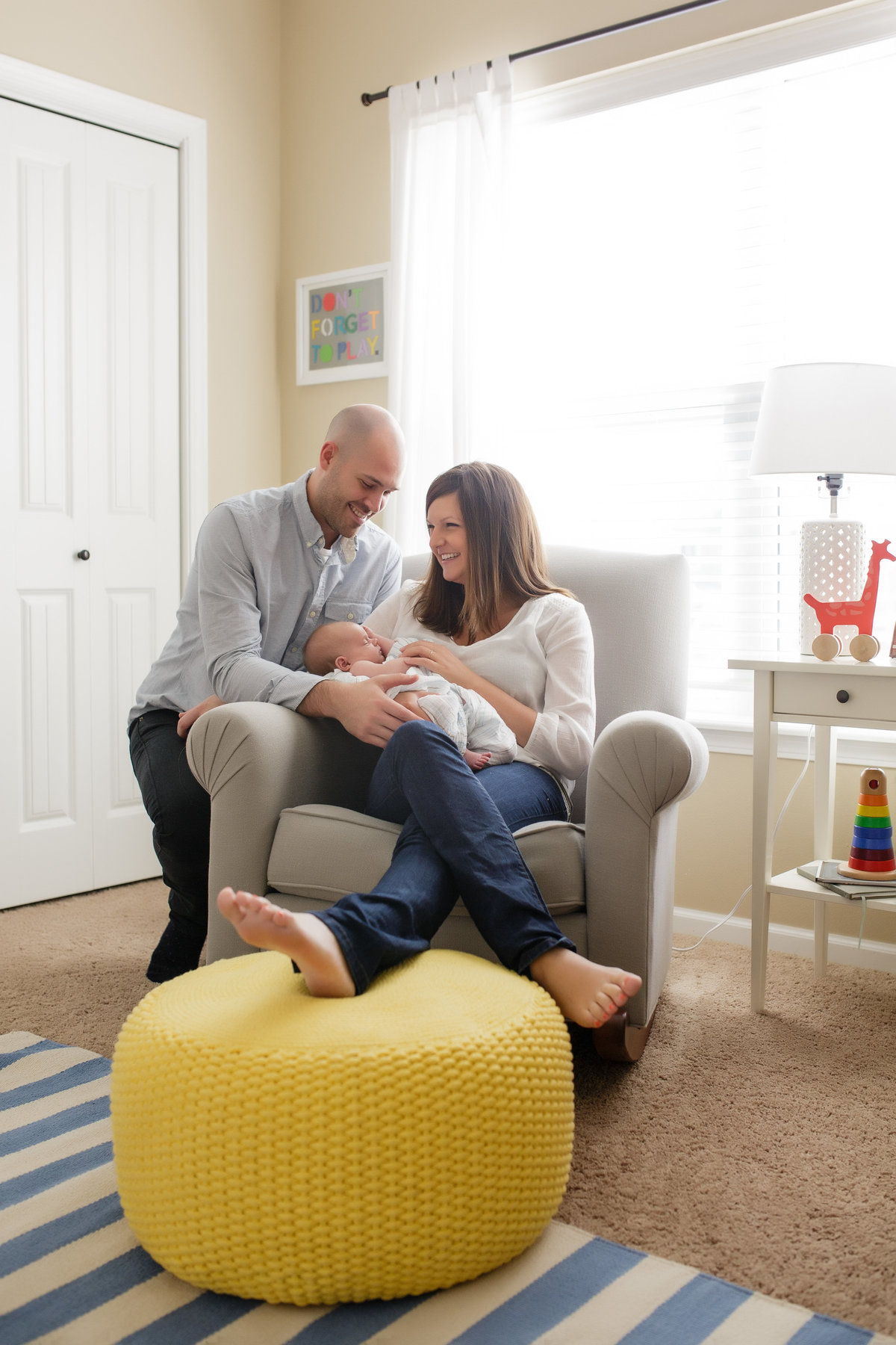 Parents holding newborn in nursery rocker - Jen Madigan Photography - Plainfield Newborn Photographer