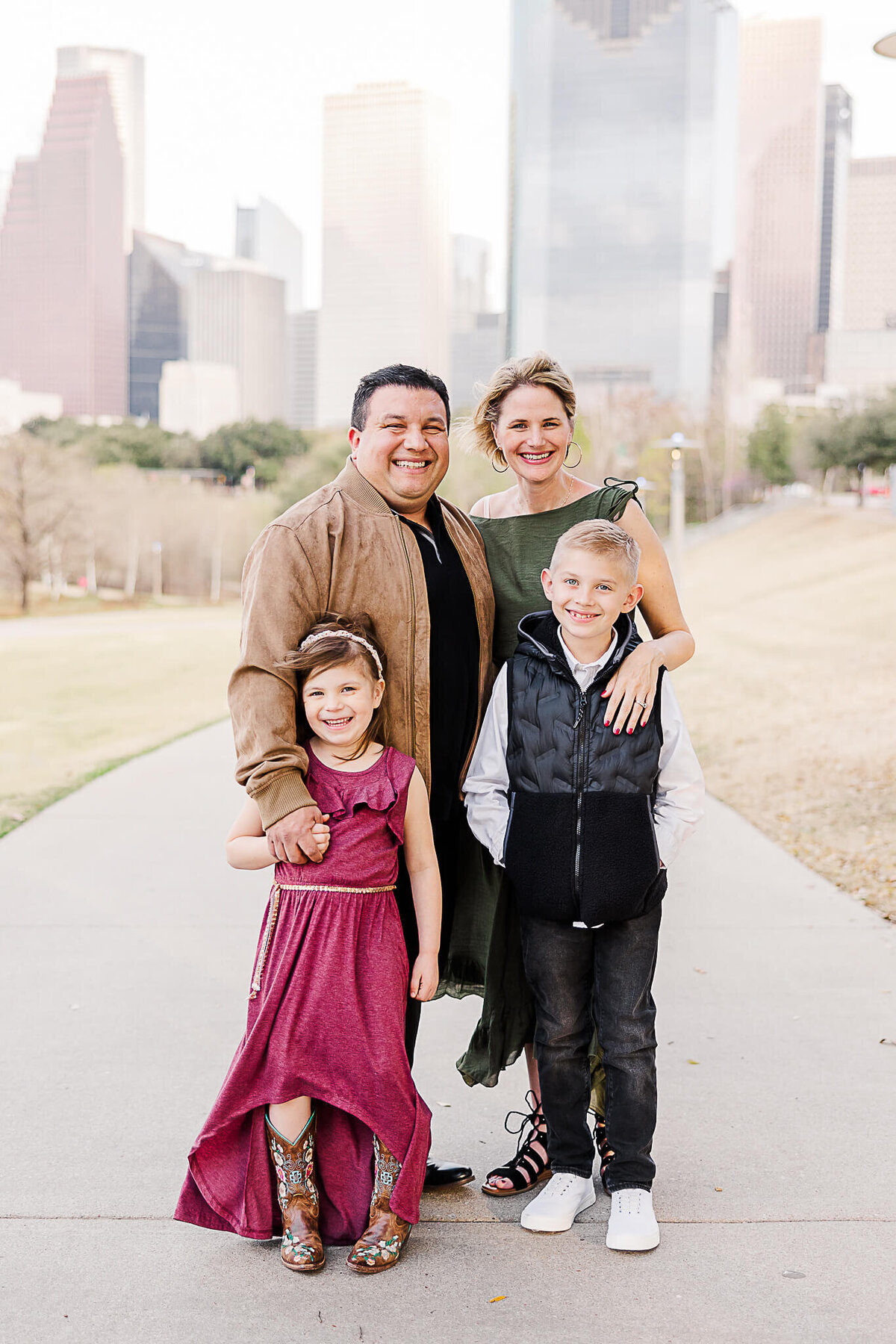 Family photo with Houston Skyline in the background