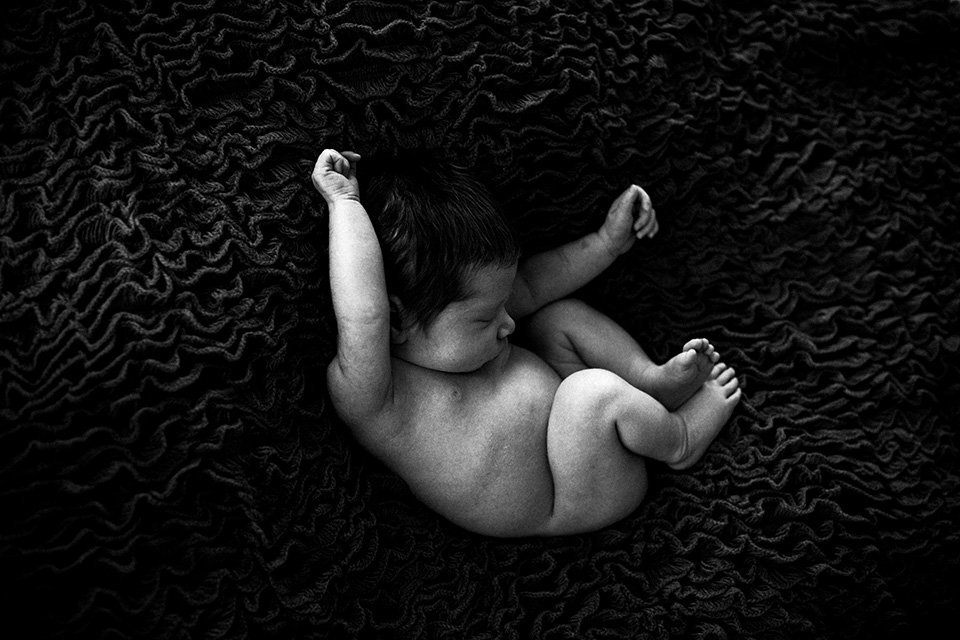 Baby on a black blanket