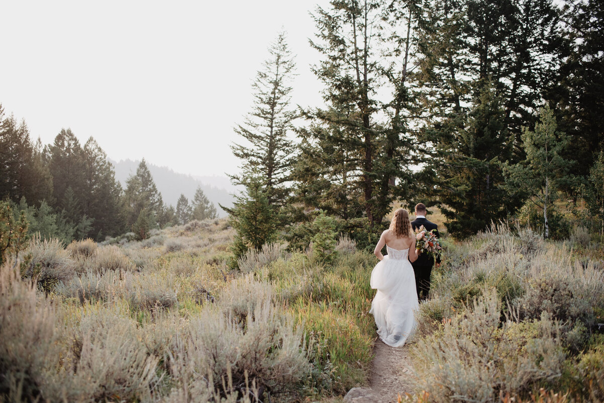 Jackson Hole Photographers capture bride walking through Grand Tetons