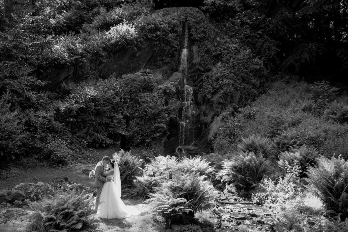 Black and white of Bride and Groom at cascade Hestercombe Gardens