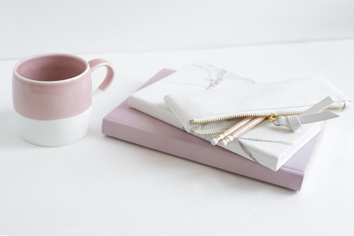 Pink mug and notebooks for Fort Worth Small Business Mentoring