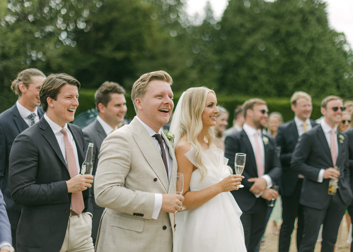 chloe-winstanley-weddings-grittleton-house-speeches-bride-groom-laughing