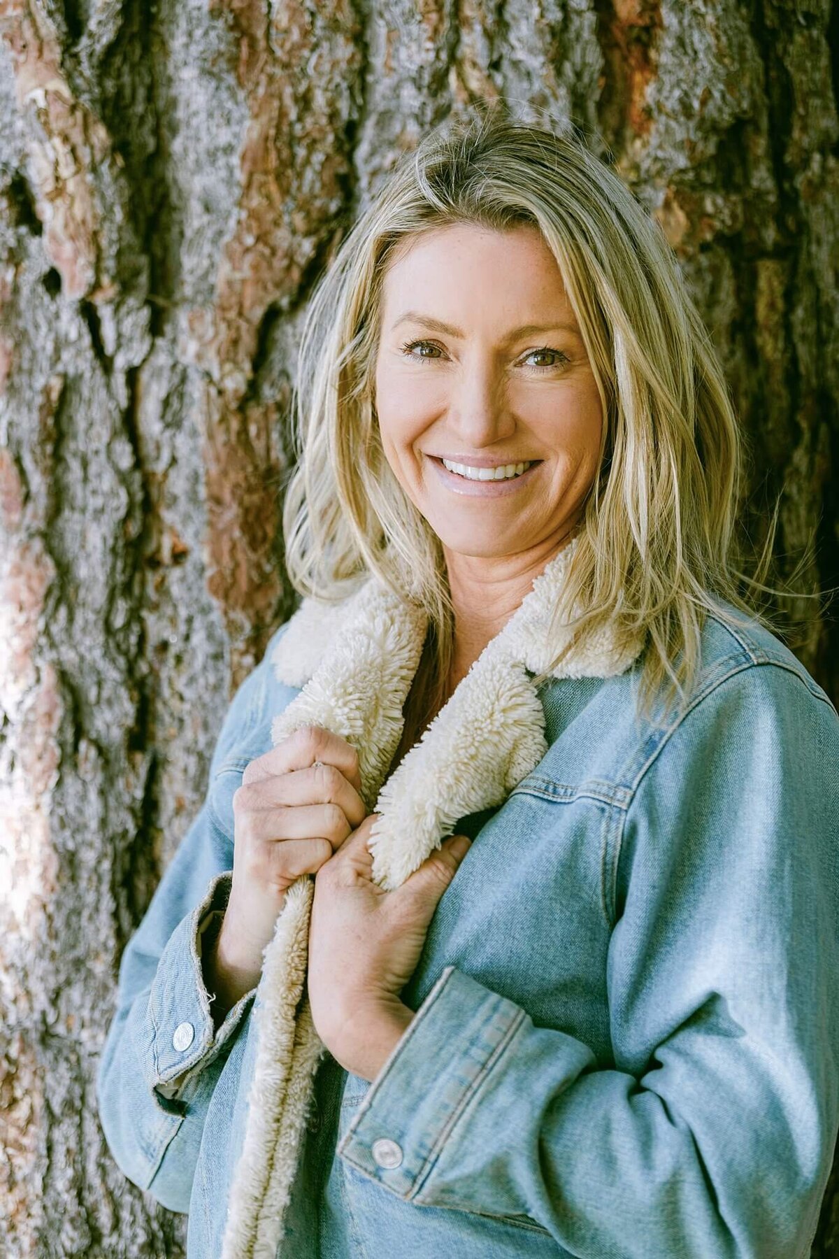 book author relaxed headshot wearing a jean jacket close up