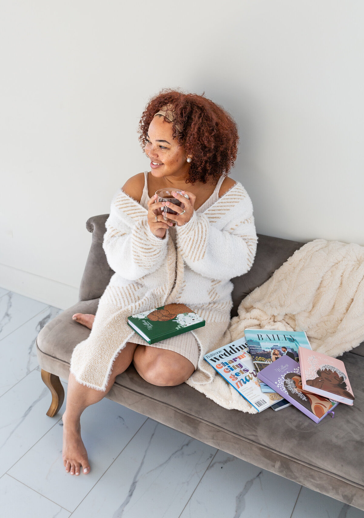 An-african-american-business-owner-snuggles-during-her-cozy-branding-session-in-Baltimore
