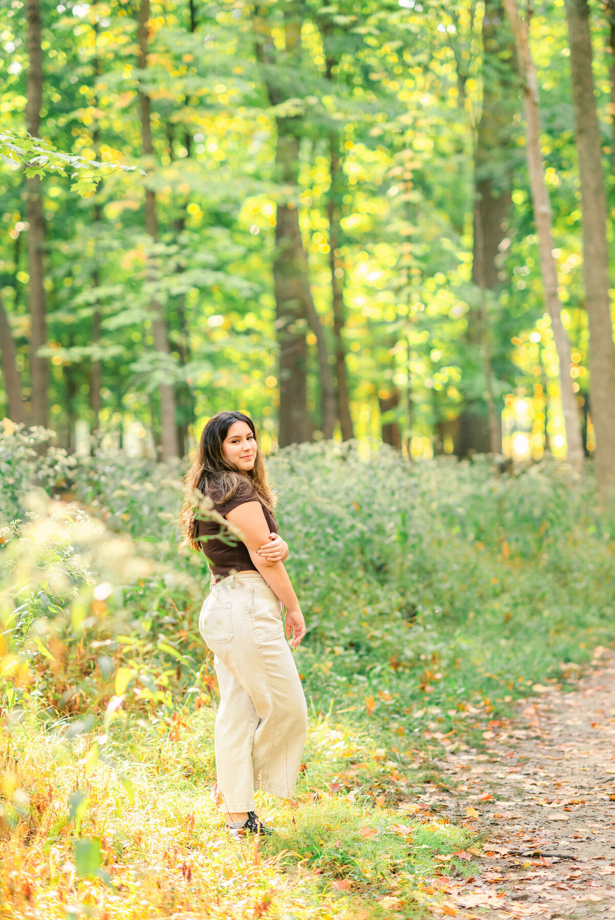 High school senior girl in the woods