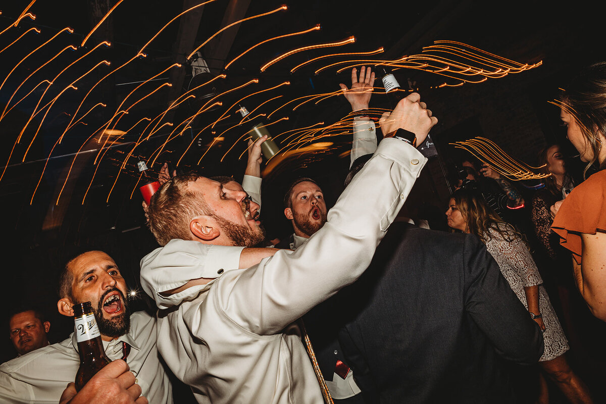 Maryland wedding photographer captures bridal party on a party bus dancing together for a Baltimore wedding