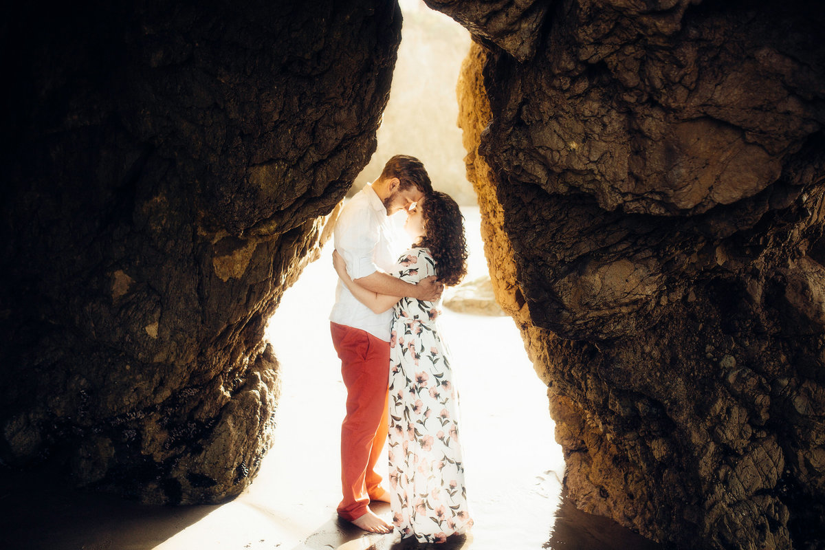Engagement Photograph Of  Man And Woman Hugging In The Middle Of a Rock Formation Los Angeles