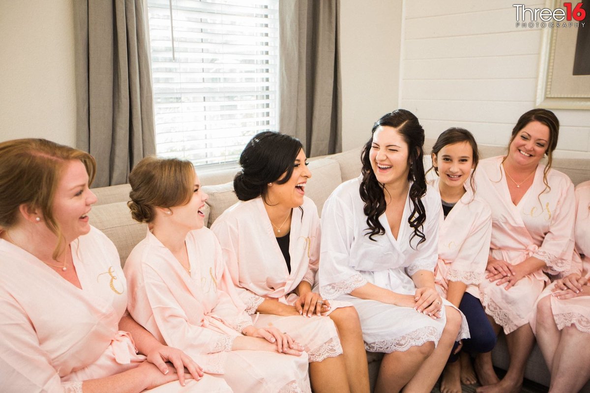 Bride sharing a laugh with her bridesmaids