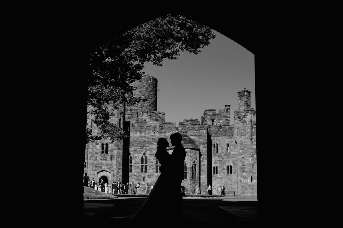 a silhouette of the bride and groom at peckforton castle