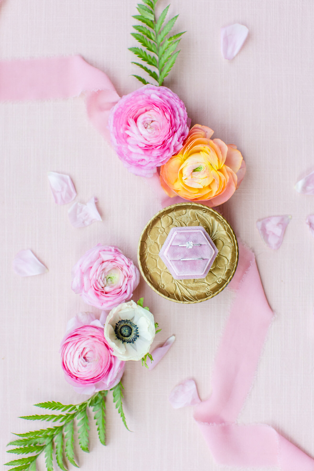 pink florals on wedding day  with pink ring box and gold tray
