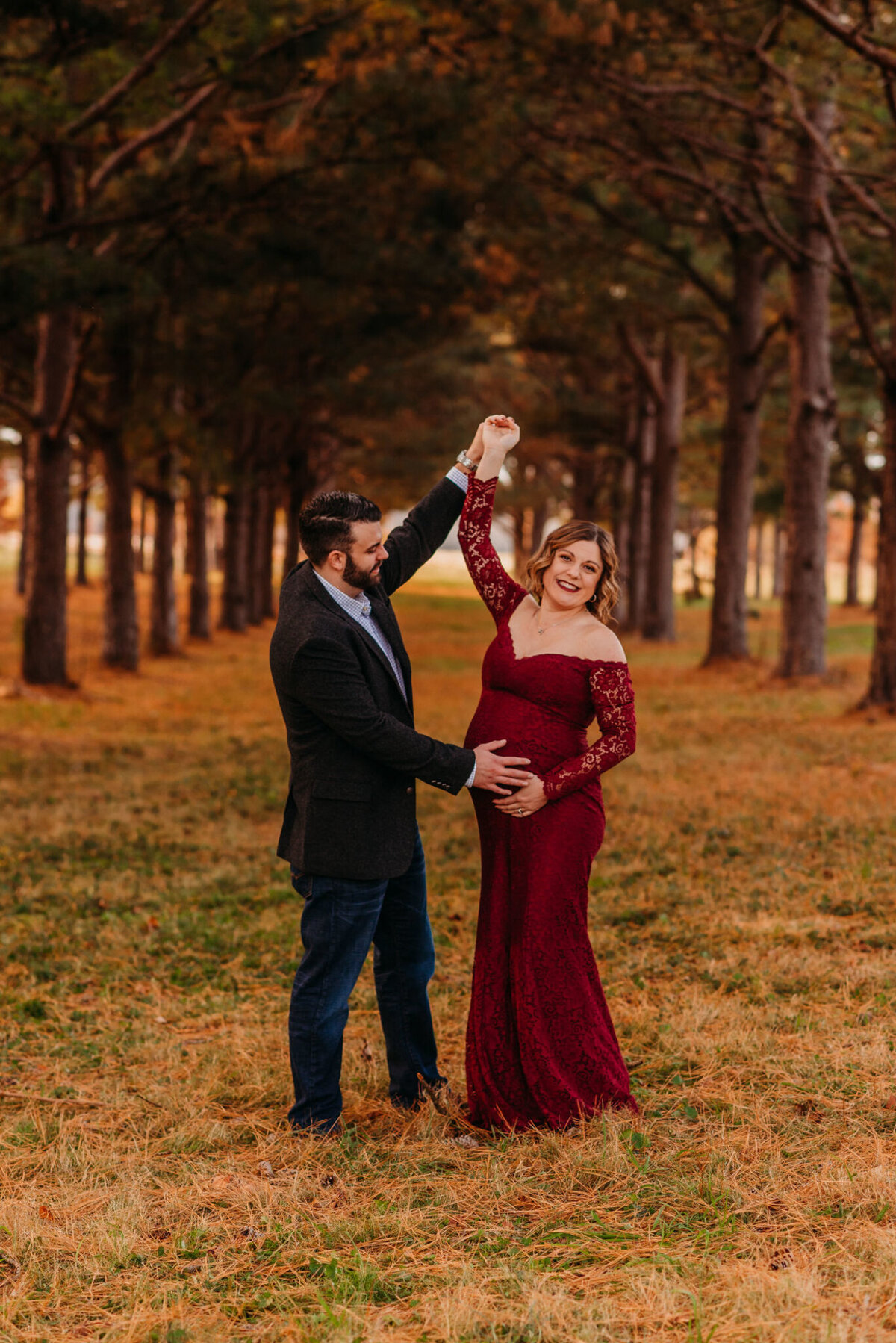 photo of pregnant woman dancing with husband
