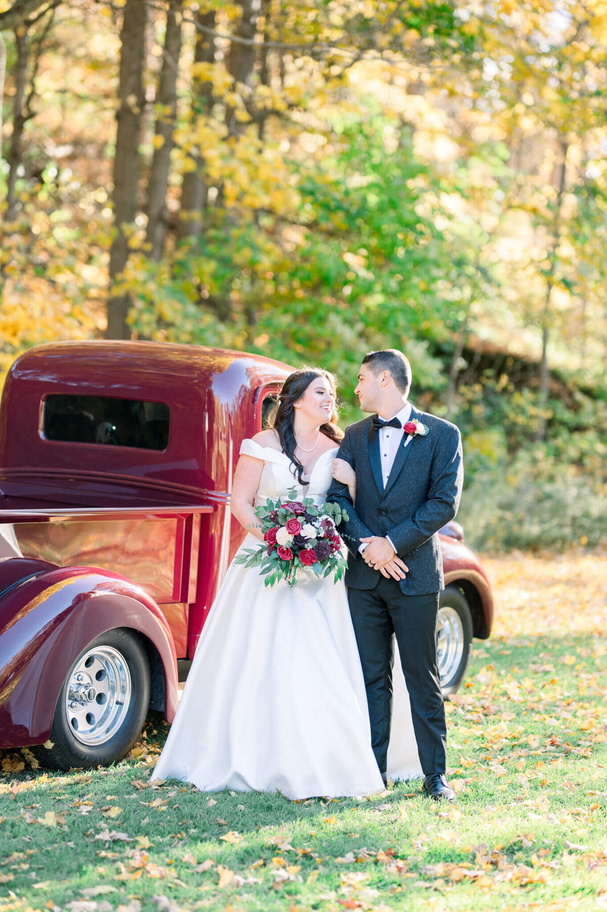 Bride and groom wedding portrait in Toronto with vintage red truck