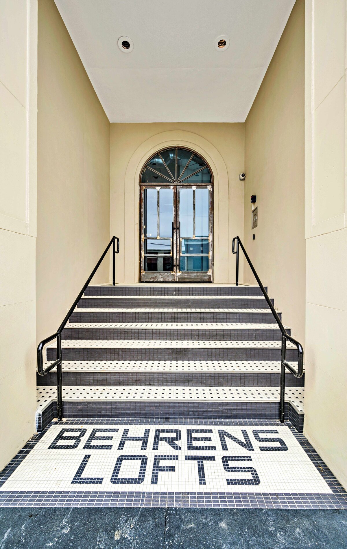 Entrance to the Behrens Lofts building of this one-bedroom, one-bathroom vintage industrial condo with Smart TV, free Wi-Fi, and washer/dryer located in downtown Waco, TX.