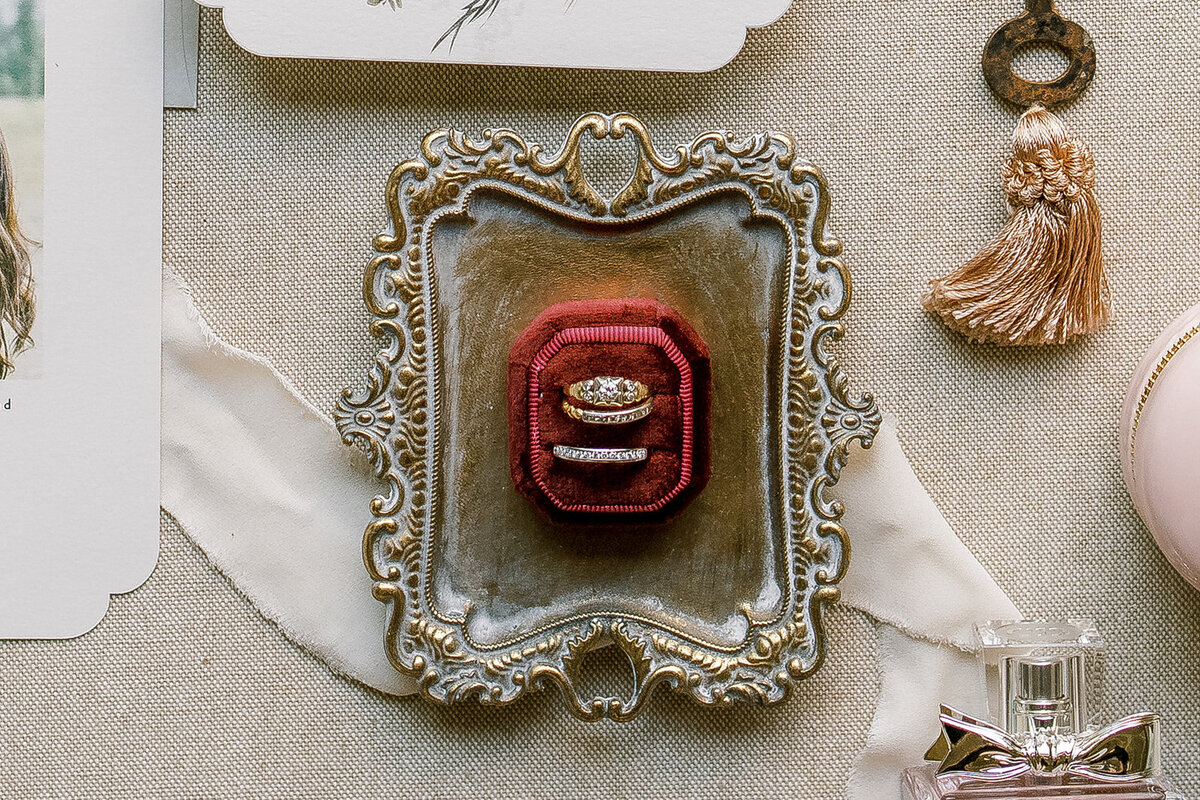 Wedding rings in vintage red velvet box at Union Hill inn in Sonora CA