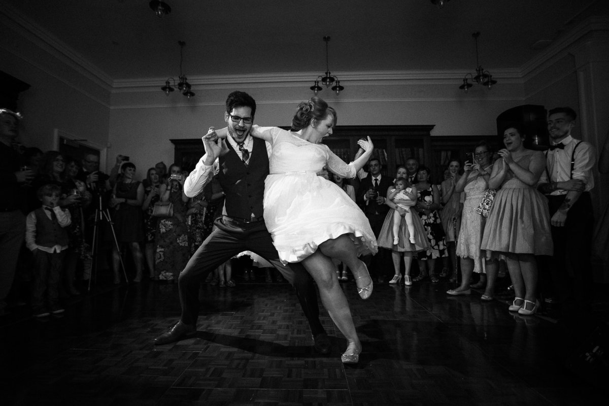 Bride and groom doing a fun creative choreographed dance for their first dance