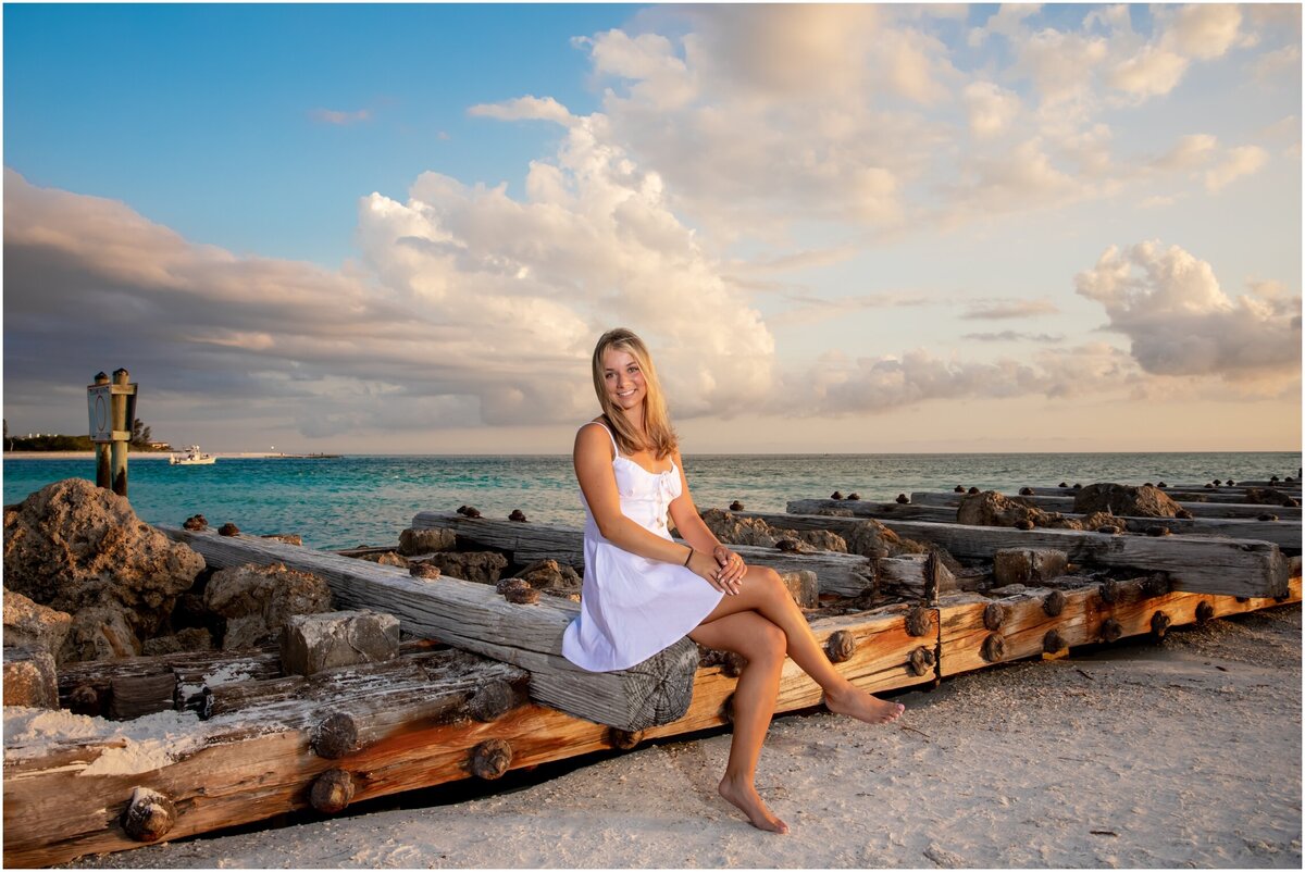 High school senior girl  posing on the jetty at Coquina Beach Park taken by Love and Style Photography