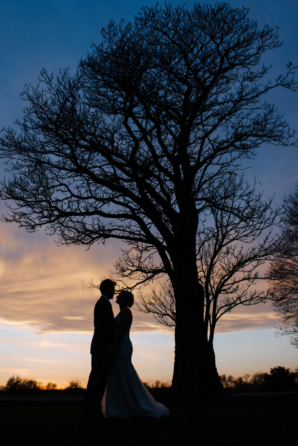 bride and groom sunset silhouette