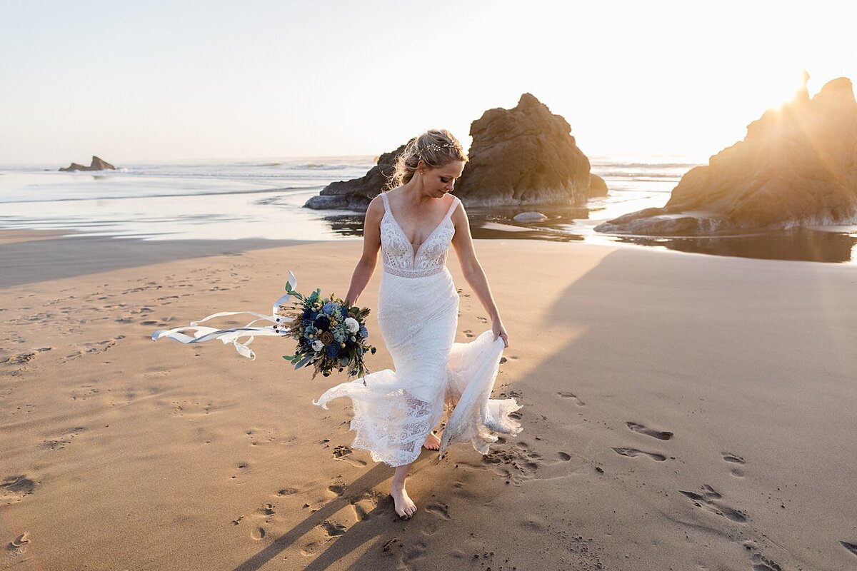 Gorgeous bride standing on windy Oregon beach