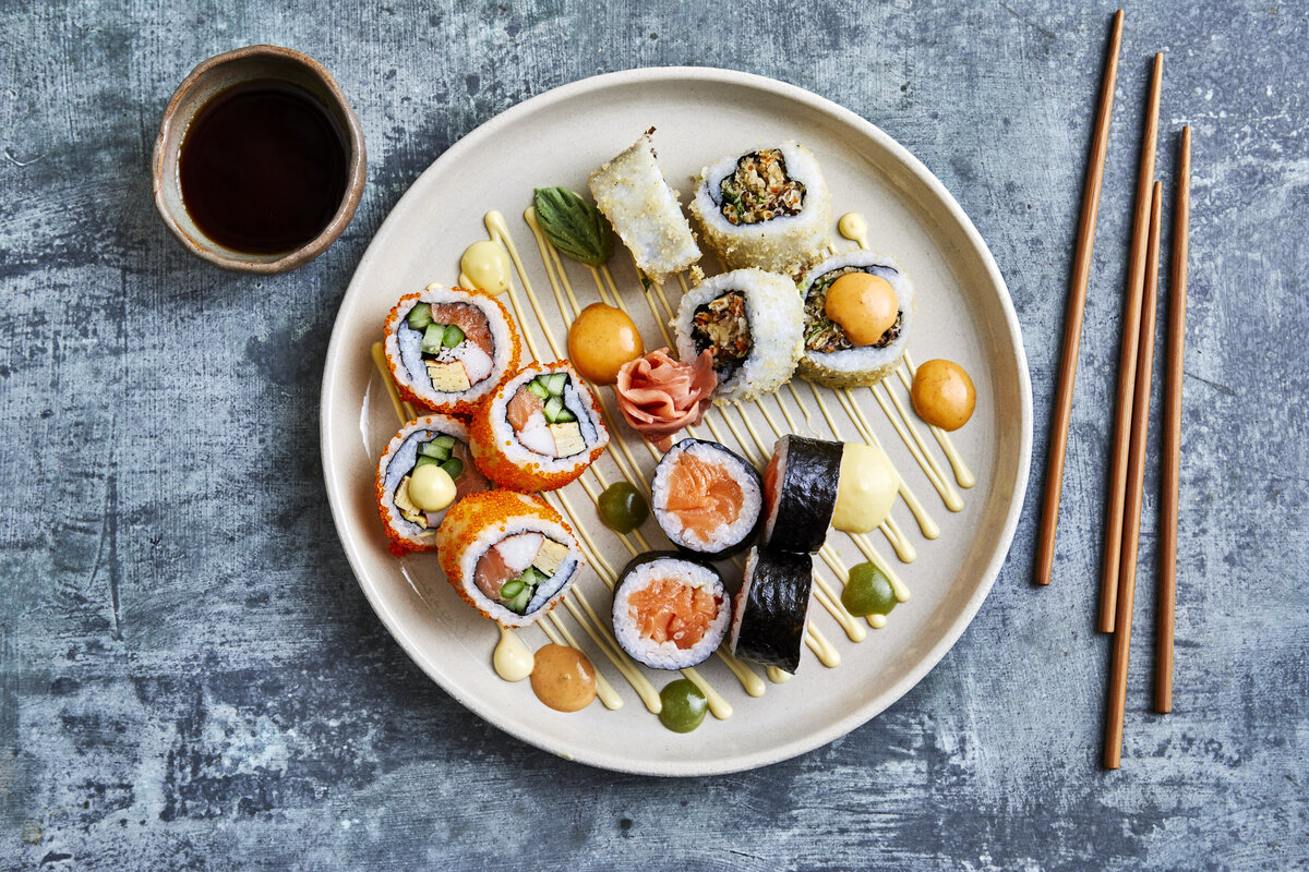 A small plate with a few different types of sushi on it.