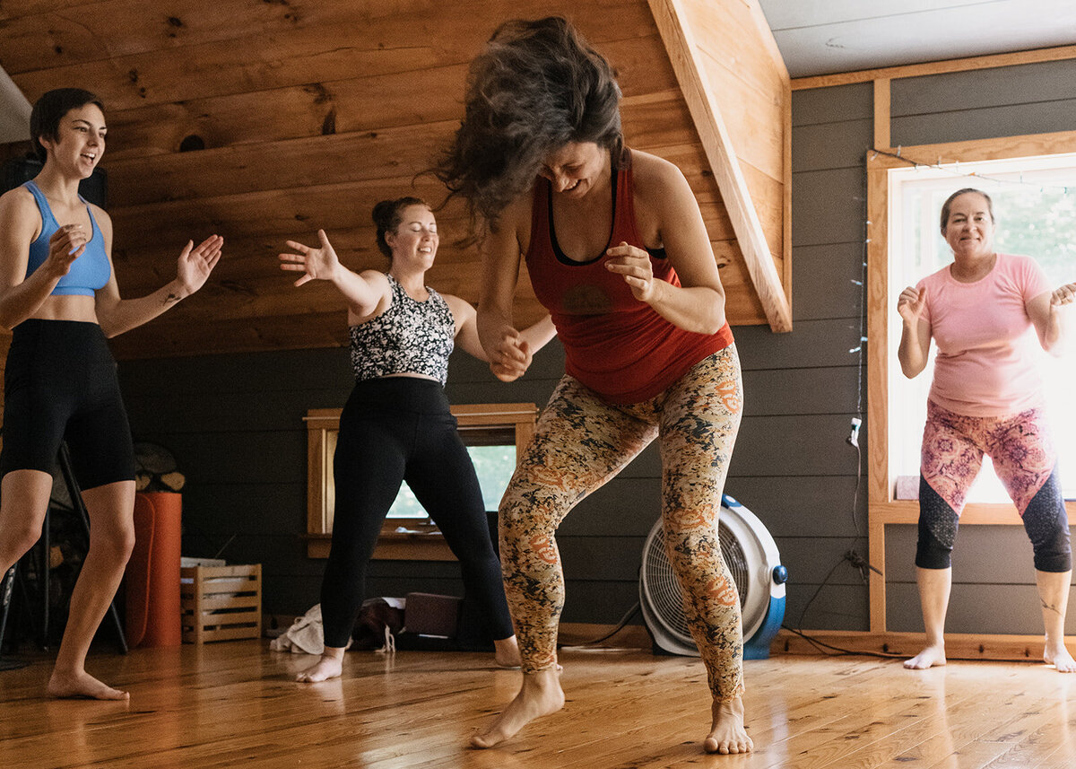 women free dancing at a wellness retreat in Maine