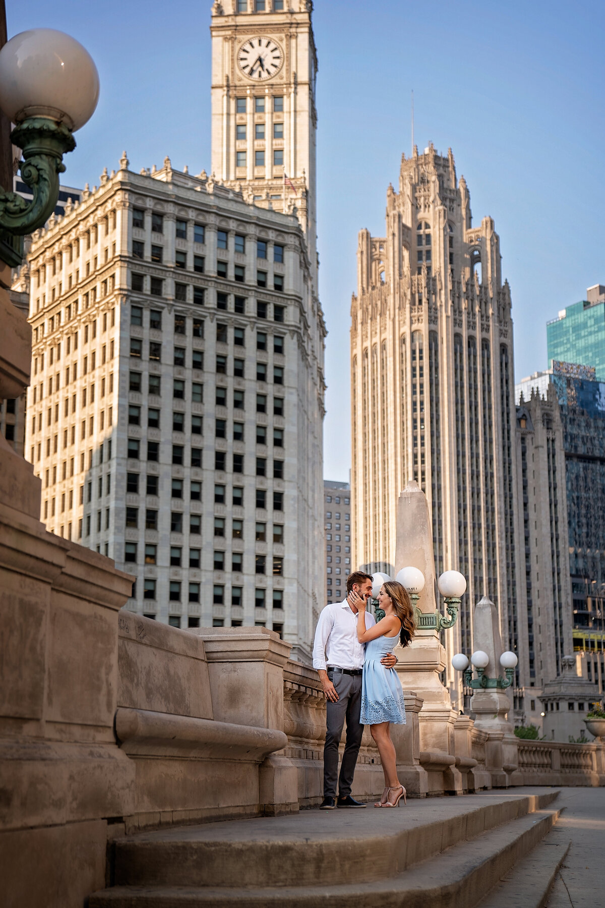 stylish lovers in the heart of Chicago surrounded by  tall skyscrapers