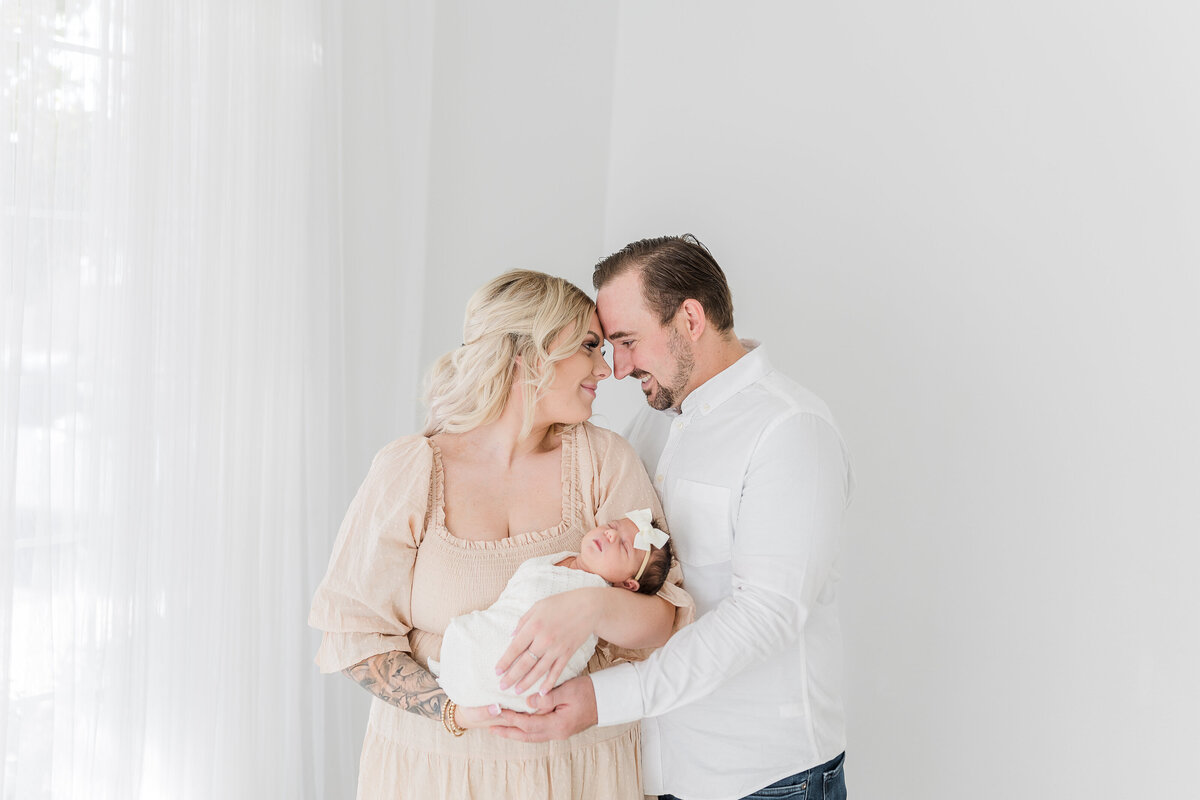 Folsom studio newborn photoshoot with a crisp white background