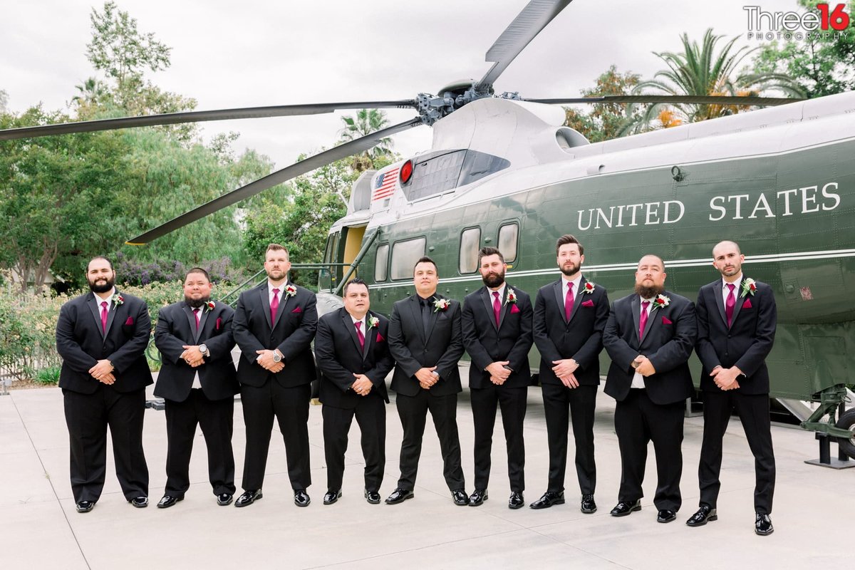 Groom and his Groomsmen pose in front of the helicopter at the Richard Nixon Library