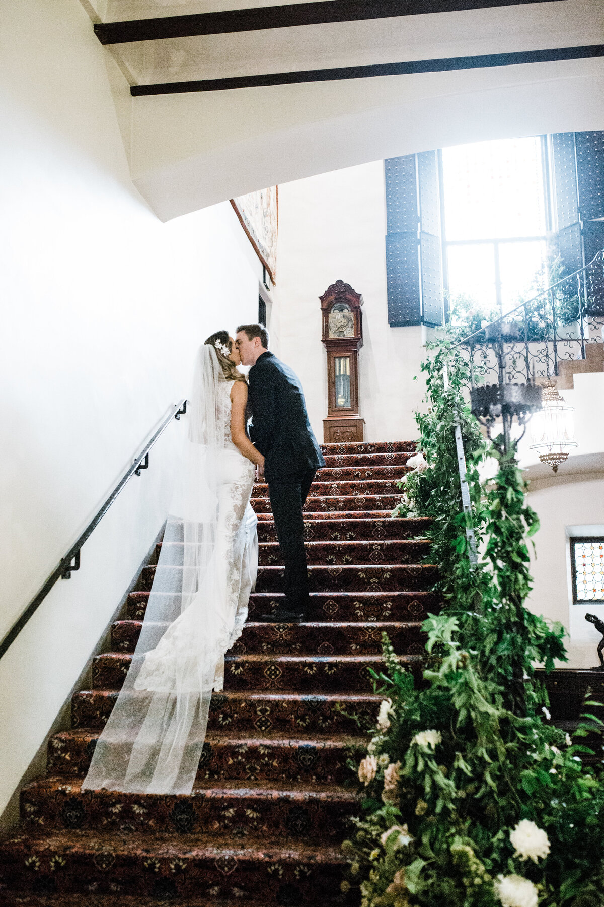 bride groom walking up staircase