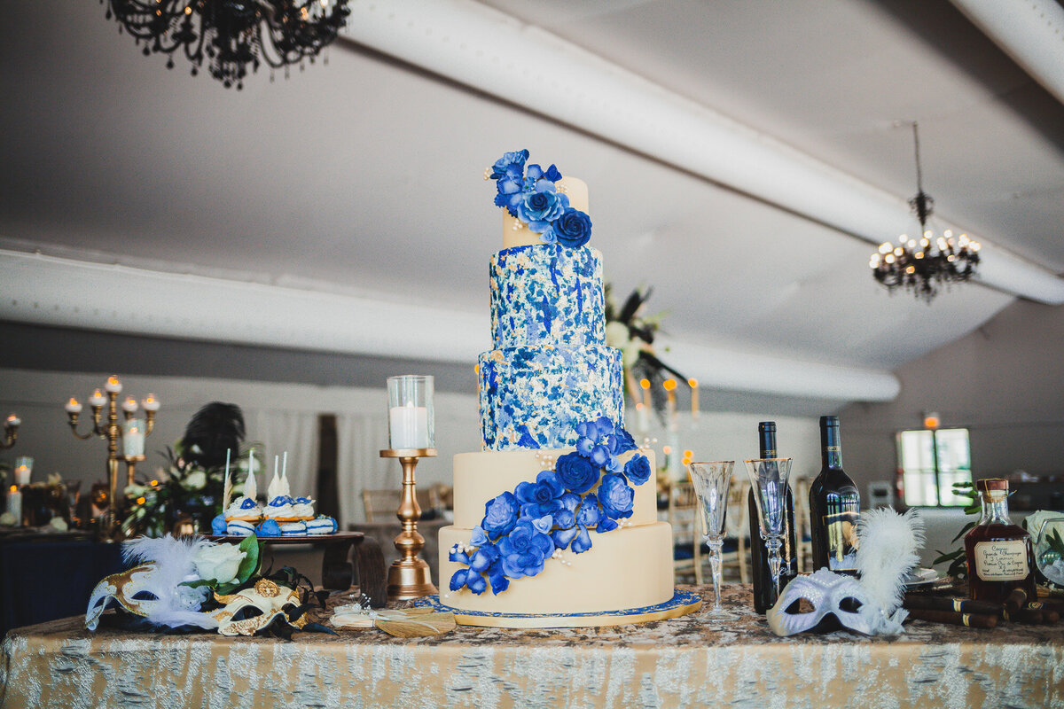 Elegant five tier cake with blue floral details