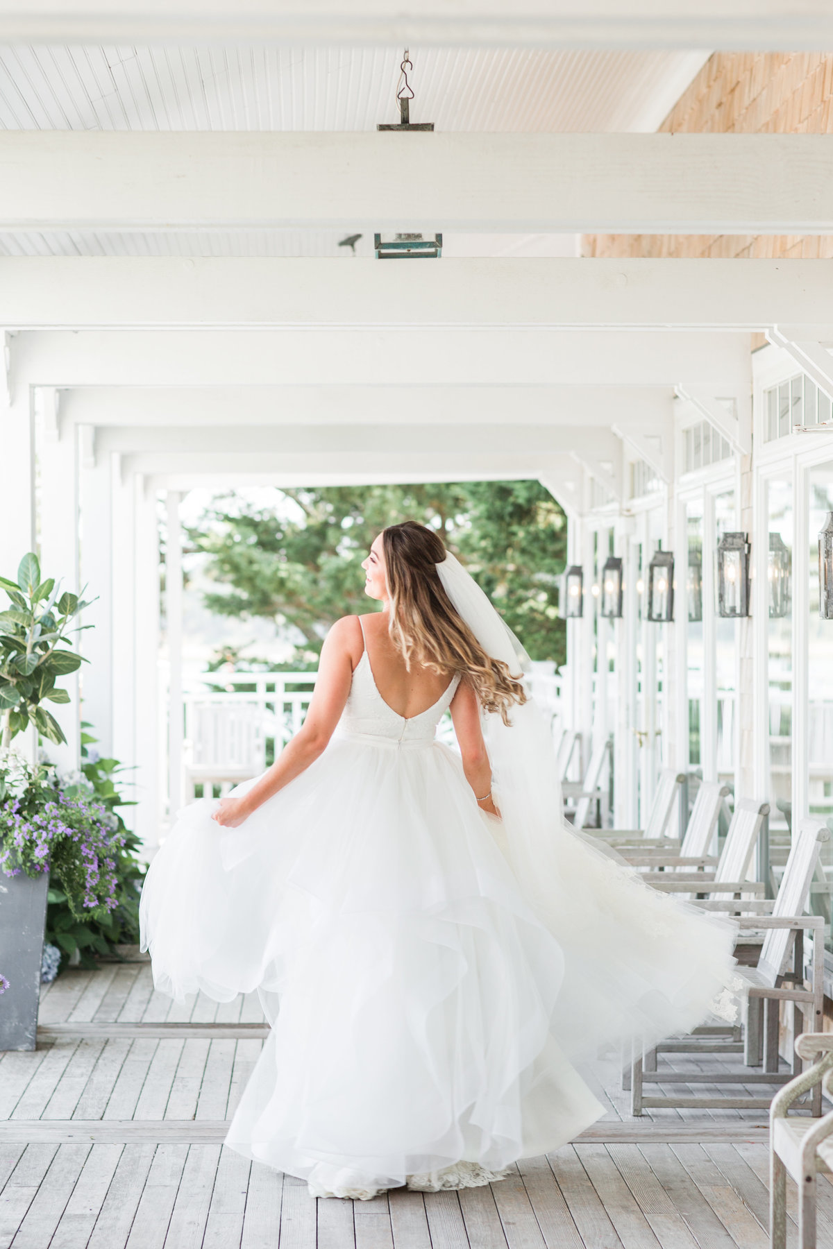 Bride twirling in her dress at Wequassett Resort and Spa
