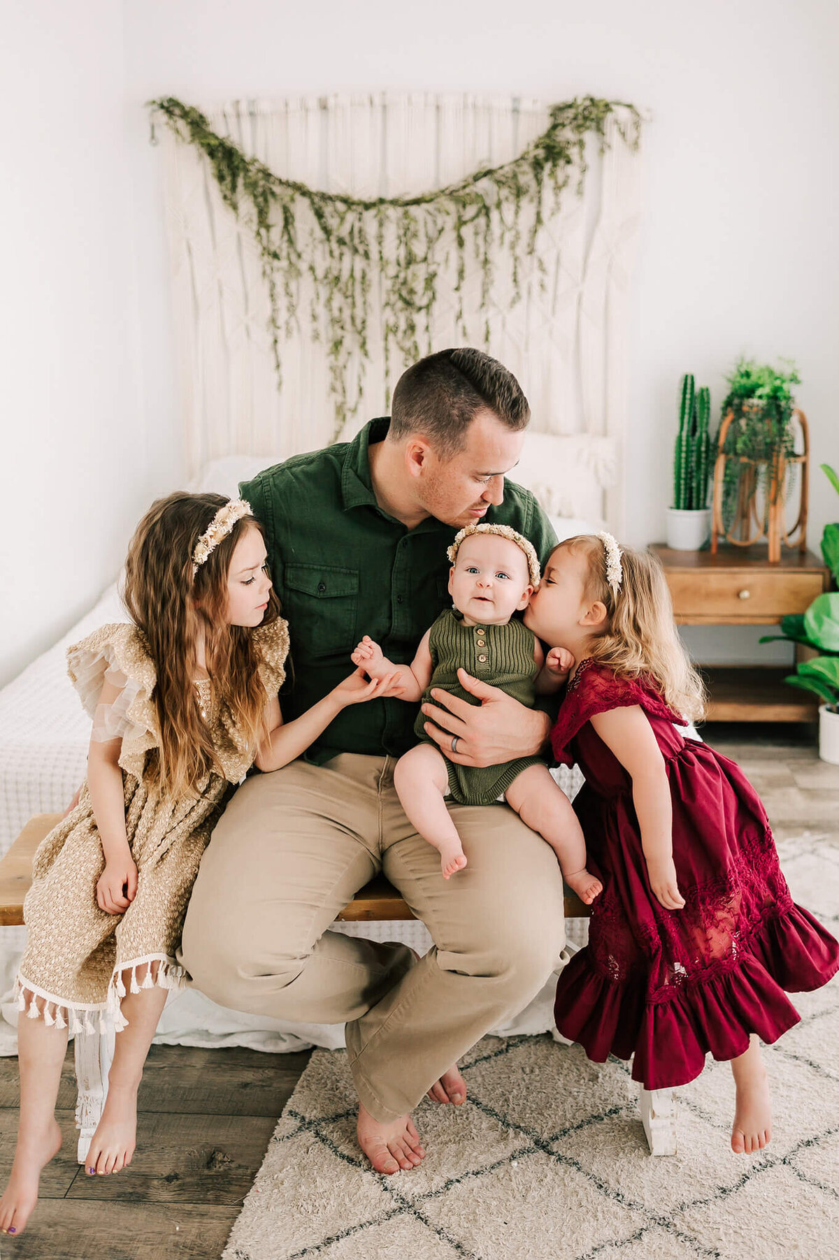 dad and kids kissing smiling baby captured by Springfield MO family photographer Jessica Kennedy of The XO Photography