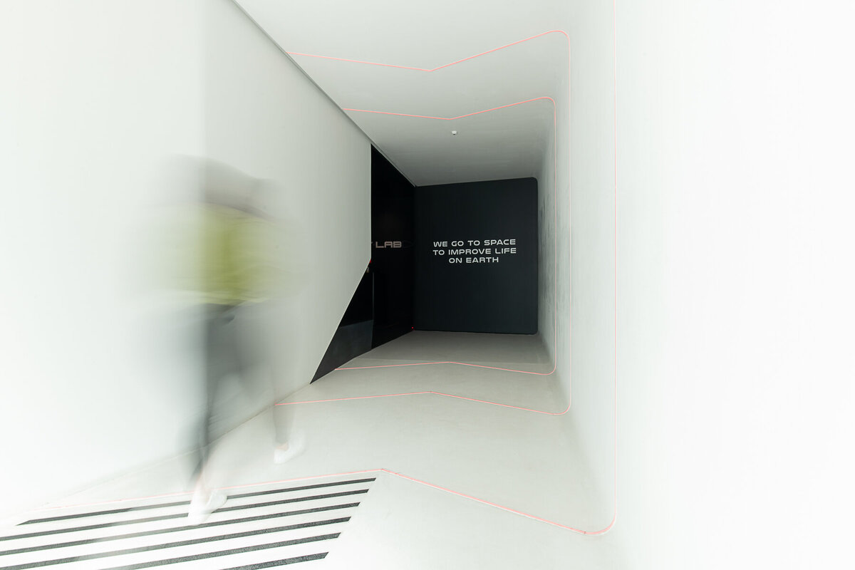 ERocket lab's Auckland Production Centre. Entry corridor, with slow shutter person entering.