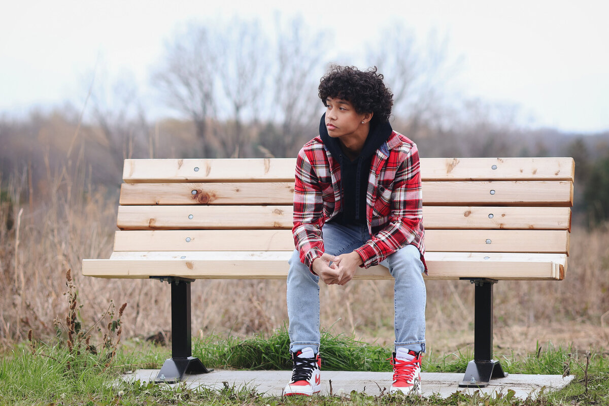 boy on bench in nature