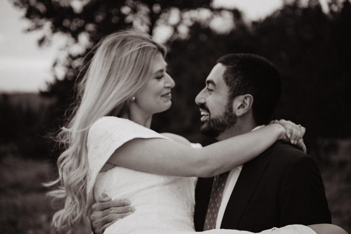 Photographers Jackson Hole capture groom holding bride