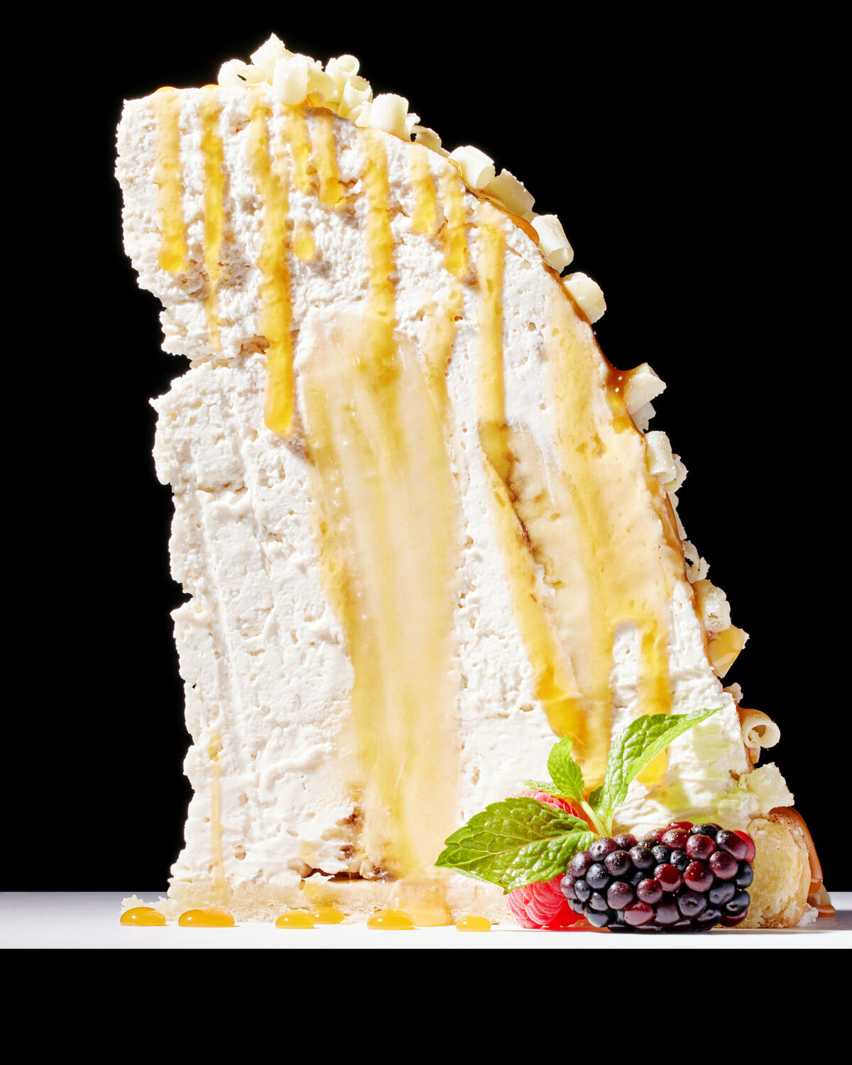 A tall cake with fruit